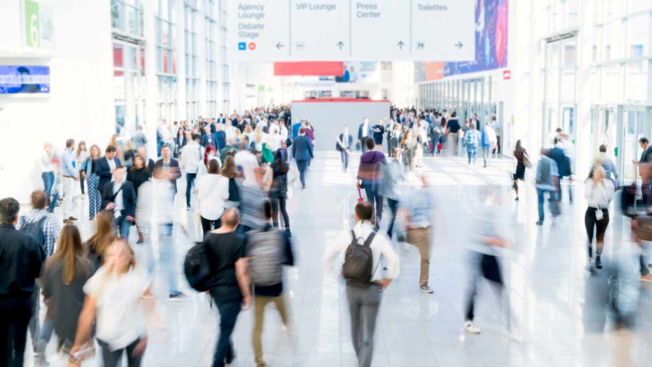 blurred people at a trade fair